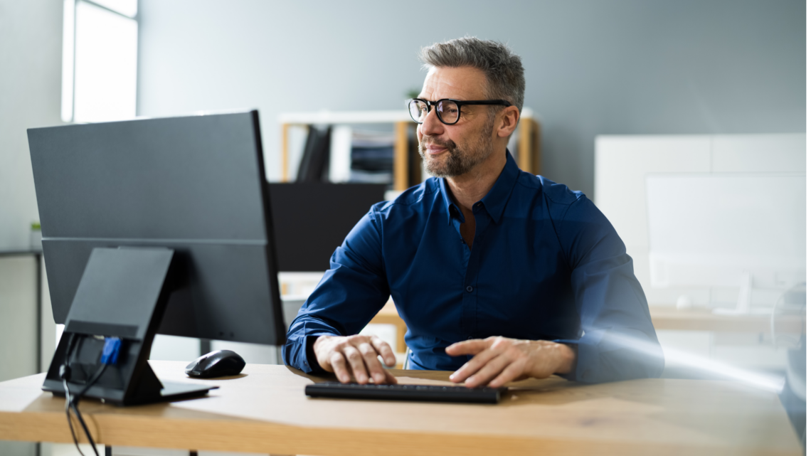 Background image of Southwest Florida real estate agent refreshing their professional bio on a laptop